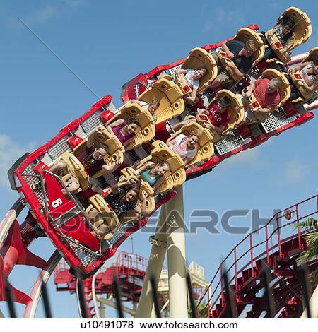 Stock Photo - People enjoying rollercoaster ride, Universal Studios, Orlando, Florida, USA. Fotosearch