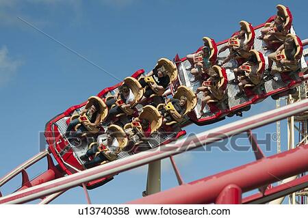 Stock Photo - People enjoying rollercoaster ride, Universal Studios, Orlando, Florida, USA. Fotosearch