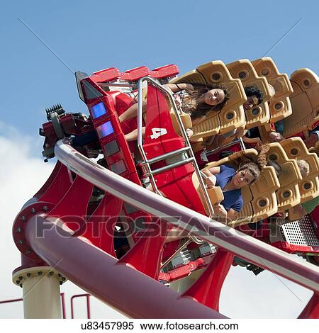 Stock Photography - People enjoying rollercoaster ride, Universal Studios, Orlando, Florida, USA. Fotosearch