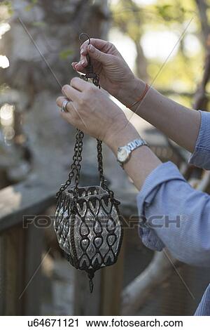 Person holding a lantern, Lake of The Woods, Keewatin, Ontario, Canada View Large Photo Image Stock Image - Person holding a lantern, Lake of The Woods, Keewatin, Ontario, Canada. Fotosearch
