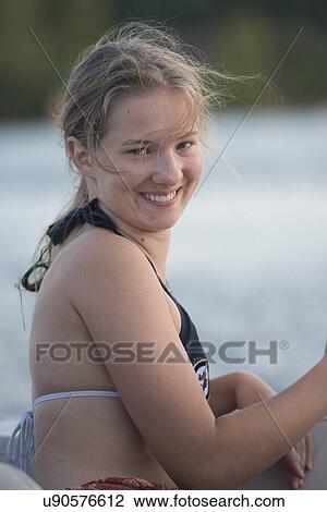 Portrait of a woman smiling, Lake of The Woods, Keewatin, Ontario, Canada View Large Photo Image Stock Image - Portrait of a woman smiling, Lake of The Woods, Keewatin, Ontario, Canada. Fotosearch