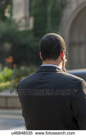 Rear view of a businessman in Chicago, Cook County, Illinois, USA View Large Photo Image Stock Photography - Rear view of a businessman in Chicago, Cook County, Illinois, USA. Fotosearch