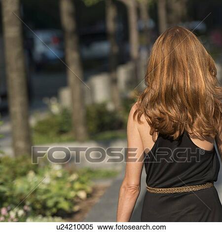 Rear view of a woman walking, Chicago, Cook County, Illinois, USA View Large Photo Image Stock Photography - Rear view of a woman walking, Chicago, Cook County, Illinois, USA. Fotosearch