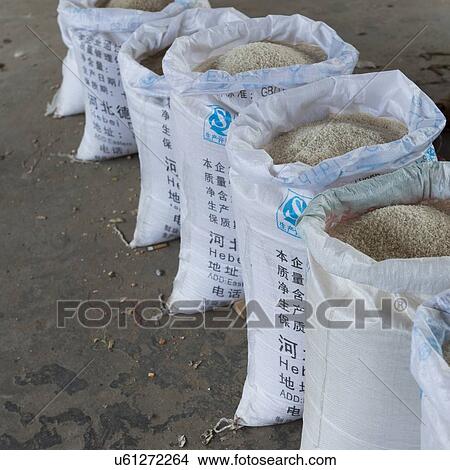 Rice sacks for sale in a store, Xingping, Yangshuo, Guilin, Guangxi Province, China View Large Photo Image Picture - Rice sacks for sale in a store, Xingping, Yangshuo, Guilin, Guangxi Province, China. Fotosearch