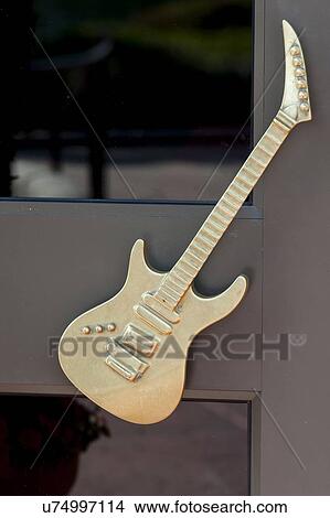 Picture - Sculpture of guitar on the door of Hard Rock Cafe, Universal Studios, Orlando, Florida, USA. Fotosearch