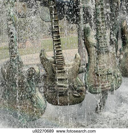 Stock Photo - Sculptures of guitars at a fountain, Universal Studios, Orlando, Florida, USA. Fotosearch