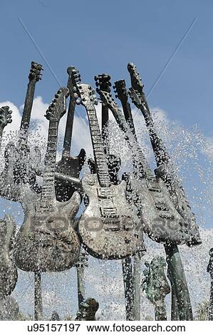 Stock Photo - Sculptures of guitars at a fountain, Universal Studios, Orlando, Florida, USA. Fotosearch