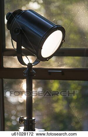 Stock Image - Spotlight near a window, Keewatin, Ontario, Canada. Fotosearch