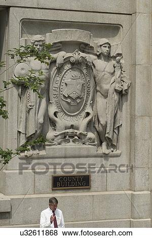 Stock Photo - Statues carved on a wall of Cook County Building, Chicago, Cook County, Illinois, USA. Fotosearch