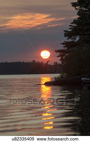 Sunset at Lake of The Woods, Keewatin, Ontario, Canada View Large Photo Image Stock Photo - Sunset at Lake of The Woods, Keewatin, Ontario, Canada. Fotosearch