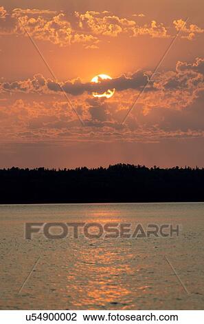 Sunset over a lake, Lake of The Woods, Ontario, Canada View Large Photo Image Stock Image - Sunset over a lake, Lake of The Woods, Ontario, Canada. Fotosearch