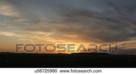 Sunset over a prairie field, Manitoba, Canada View Large Photo Image Stock Image - Sunset over a prairie field, Manitoba, Canada. Fotosearch