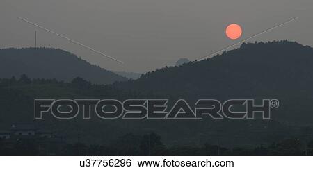 Sunset over mountain, Yangshuo, Guilin, Guangxi Province, China View Large Photo Image Stock Photograph - Sunset over mountain, Yangshuo, Guilin, Guangxi Province, China. Fotosearch