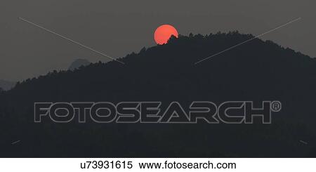 Sunset over mountain, Yangshuo, Guilin, Guangxi Province, China View Large Photo Image Stock Photography - Sunset over mountain, Yangshuo, Guilin, Guangxi Province, China. Fotosearch