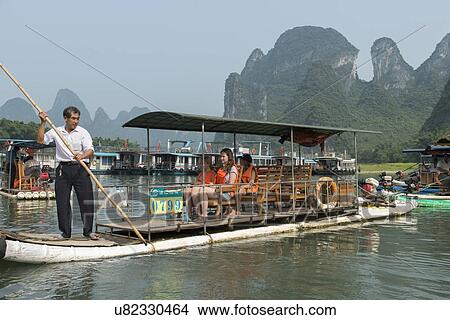 Picture - Tourboats in the Li River, Xingping, Yangshuo, Guilin, Guangxi Province, China. Fotosearch