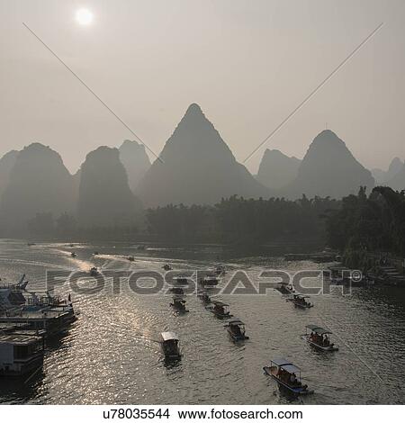 Picture - Tourboats on the Li River, Yangshuo, Guilin, Guangxi Province, China. Fotosearch