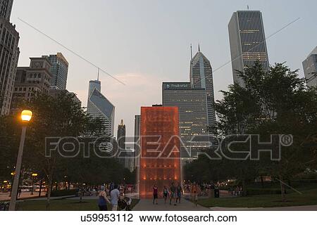 Stock Image - Tourists at Crown Fountain, Millennium Park, E Monroe Street, Chicago, Cook County, Illinois, USA. Fotosearch