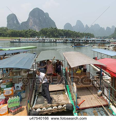 Tourists on a tourboat, Li River, Xingping, Yangshuo, Guilin, Guangxi Province, China View Large Photo Image Stock Photograph - Tourists on a tourboat, Li River, Xingping, Yangshuo, Guilin, Guangxi Province, China. Fotosearch