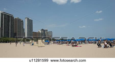 Tourists on the beach, Lake Michigan, Chicago, Cook County, Illinois, USA View Large Photo Image Stock Photo - Tourists on the beach, Lake Michigan, Chicago, Cook County, Illinois, USA. Fotosearch