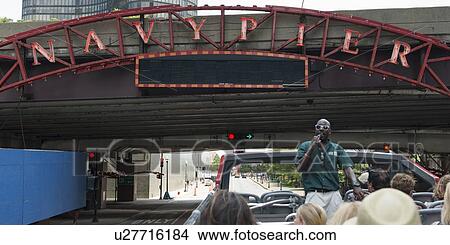 Tourists traveling in an open air bus with a tour guide, Michigan Avenue, Chicago, Cook County, Illinois, USA View Large Photo Image Picture - Tourists traveling in an open air bus with a tour guide, Michigan Avenue, Chicago, Cook County, Illinois, USA. Fotosearch