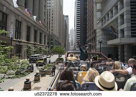 Tourists traveling in an open air bus with a tour guide, Michigan Avenue, Chicago, Cook County, Illinois, USA View Large Photo Image Stock Photo - Tourists traveling in an open air bus with a tour guide, Michigan Avenue, Chicago, Cook County, Illinois, USA. Fotosearch