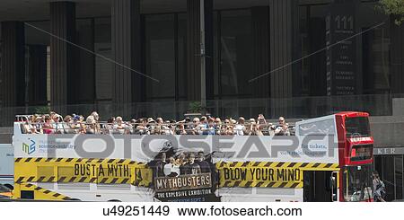 Stock Photo - Tourists traveling in an open-air tour bus, Chicago, Cook County, Illinois, USA. Fotosearch
