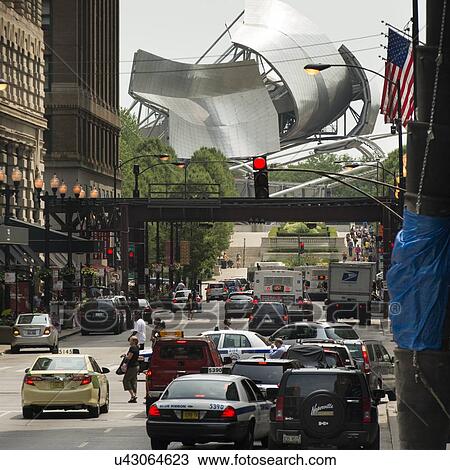 Stock Image - Traffic on the road, Jay Pritzker Pavilion, Millennium Park, Chicago, Cook County, Illinois, USA. Fotosearch