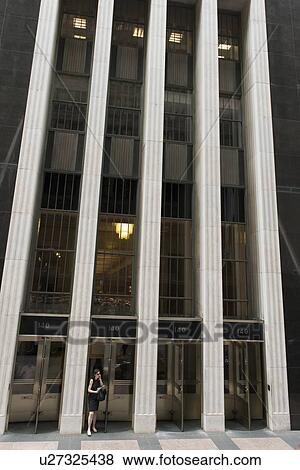 Stock Photo - Woman talking on the phone outside an office building, Chicago, Cook County, Illinois, USA. Fotosearch