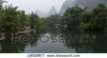 Stock Photo - Wooden rafts in the Yulong River, Yangshuo, Guilin, Guangxi Province, China. Fotosearch