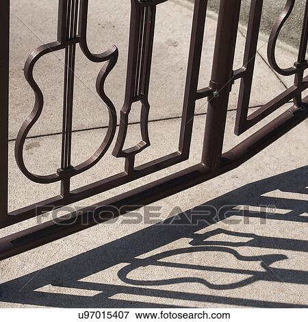 Wrought iron gate in form of guitar shapes at Hard Rock cafe, Universal Studios, Orlando, Florida, USA View Large Photo Image Stock Photo - Wrought iron gate in form of guitar shapes at Hard Rock cafe, Universal Studios, Orlando, Florida, USA. Fotosearch