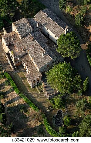 Aerial view of beautiful old stone farmhouse with surrounding cypress trees, in early morning sunshine, Middle Tiber Valley, Umbria, Italy View Large Photo Image Stock Photo - Aerial view of beautiful old stone farmhouse with surrounding cypress trees, in early morning sunshine, Middle Tiber Valley, Umbria, Italy. Fotosearch