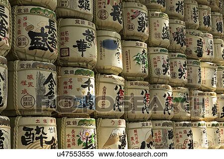 Tokyo, Japan: March 2, 2013 - Sake barrels displayed as symbolic decoration at Shinto Mehji shrine, Tokyo, Japan View Large Photo Image Stock Photography - Tokyo, Japan: March 2, 2013 - Sake barrels displayed as symbolic decoration at Shinto Mehji shrine, Tokyo, Japan. Fotosearch