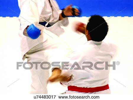 Stock Photo - attacking, challenge, bright, adults. Fotosearch