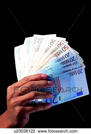 Stock Image - Black Background, Close-Up, Group Of Objects, One Person. Fotosearch