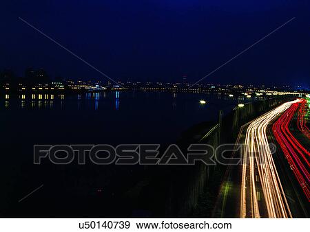 Blurred Motion, Building Exterior, City, Commute, Darkness View Large Photo Image Stock Photo - Blurred Motion, Building Exterior, City, Commute, Darkness. Fotosearch