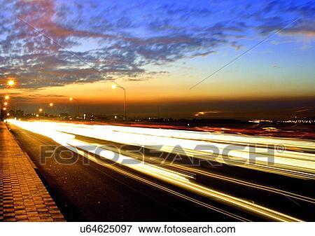 Stock Photo - Blurred Motion, Clouds, Headlight, Horizon. Fotosearch