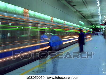 Blurred Motion, Commuters, Fast, Fluorescent Light, Group Of People View Large Photo Image Stock Photo - Blurred Motion, Commuters, Fast, Fluorescent Light, Group Of People. Fotosearch