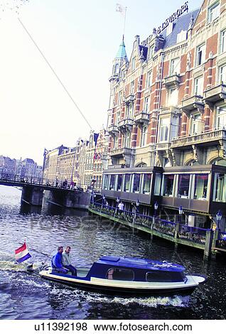 Stock Photo - Bridge, Building Exterior, Day, Flags, Medium Group Of People. Fotosearch