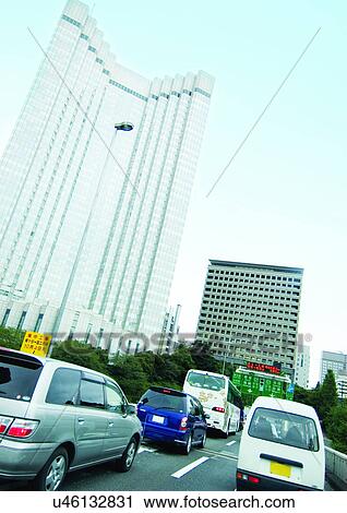 Stock Image - Building, Bus, Car, Day. Fotosearch