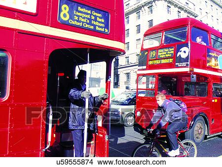 Picture - Building Exterior, Car, City Street, Cycling, Day. Fotosearch
