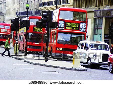 Stock Photograph - Building Exterior, Car, Day, Double Decker Bus, Headlights. Fotosearch