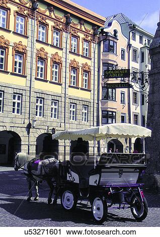 Stock Image - Building Exterior, Clouds, Day, Horse Cart, Mode Of Transport. Fotosearch