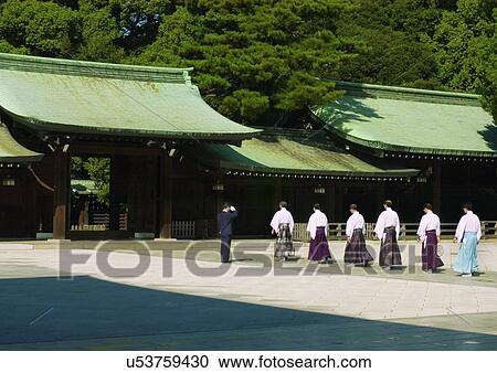 Stock Image - Building Exterior, Wood, Medium Group Of People, Rear View, Roof, Trees, Day. Fotosearch