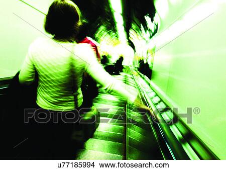 Picture - Carrying, Holding, Escalator, Indoor. Fotosearch