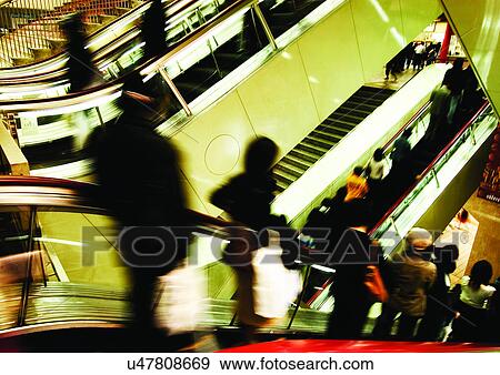 Carrying, Holding, Escalator, Indoor View Large Photo Image Stock Photo - Carrying, Holding, Escalator, Indoor. Fotosearch