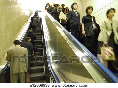 Carrying, Holding, Moving Down, Escalator, Indoor View Large Photo Image Stock Image - Carrying, Holding, Moving Down, Escalator, Indoor. Fotosearch