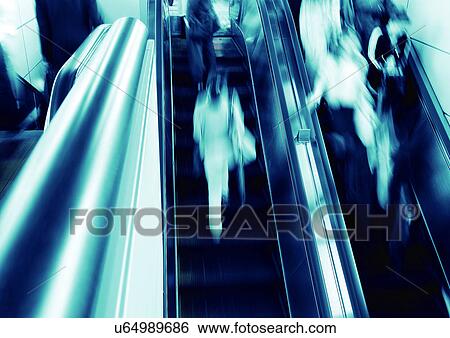 Stock Photograph - Carrying, Holding, Moving Down, Escalator, Indoor. Fotosearch