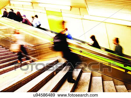 Stock Photo - Carrying, Holding, Moving Up, Escalator, Indoor. Fotosearch