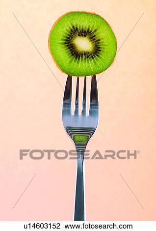 Stock Image - close-up, cut, fork, fresh fruit. Fotosearch