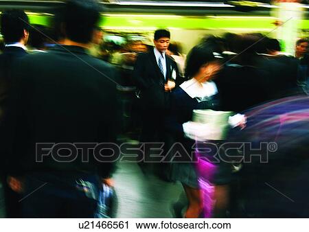 Stock Image - Commuter, Large Group Of People, Day, Formal Clothing. Fotosearch